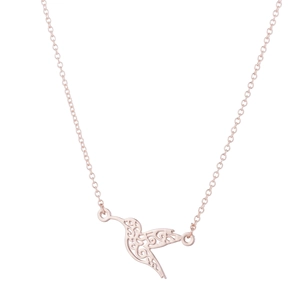 Detailed view of rose gold hummingbird pendant featuring intricate hollow out design