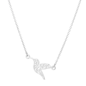 Detailed close-up of hummingbird necklace with intricate hollow filigree pattern on white base
