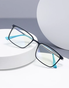 Detail of square black glasses frame with translucent sky blue temples on a white pedestal