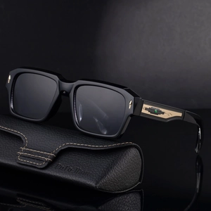 Classic black square sunglasses with gold metal decor on leather case, mirrored view
