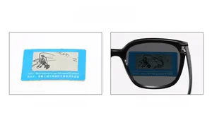 Polarized lens effect demonstration with test card showing fishing icon through sunglasses