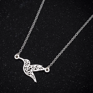 Polished silver stainless steel origami hummingbird necklace with hollow carved patterns
