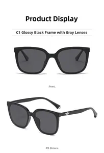 Detail view of black square polarized sunglasses with metallic wing logo and grey lenses