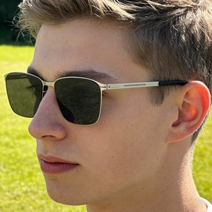 Detail of square polarized sunglasses with silver metal frame and hollow temple design