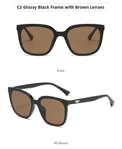 Detail of square polarized sunglasses with glossy black frames and gold wing accents