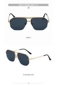 Detail view of gold metal half-frame sunglasses with grey lenses and double bridge design