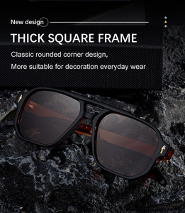 Détail macro des lunettes de soleil carrées avec charnières flèches dorées sur pierre