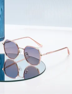 Detail of square-frame polarized sunglasses featuring purple gradient lenses and metal frame