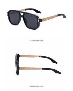 Vue détaillée des lunettes de soleil carrées avec branches en métal doré gravé