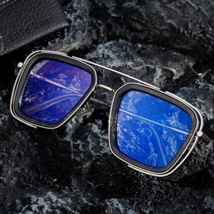 Retro square double bridge sunglasses with metal frames on black stone background