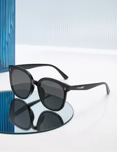 Detail of square polarized sunglasses with black frame and silver metal temple accents