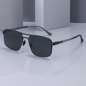 Men's square polarized nylon sunglasses with double bridge metal frame on a stone stand