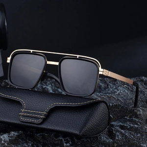 Polarized double-bridge sunglasses for men with gold frame on black stone base
