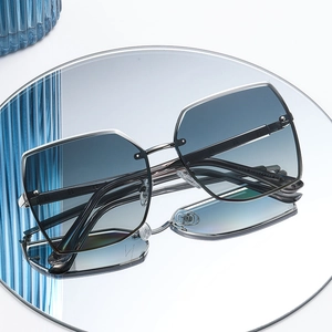 Modern square polarized sunglasses with gradient blue lenses and thin silver metal frame