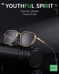 Detailed close-up of premium gold metal frames with engraved textures on square sunglasses