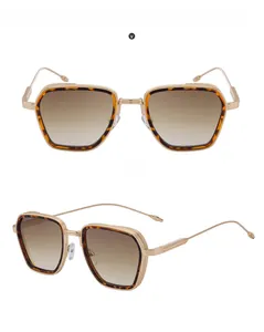 Macro detail of men's square gradient brown sunglasses with gold metal frame