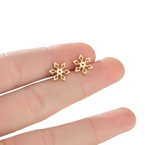 Minimalist 18K gold plated stainless steel snowflake stud earrings shown on hand for scale