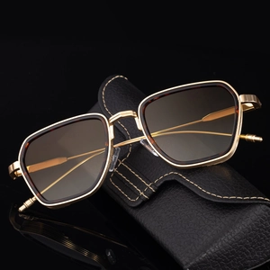 Classic pilot style sunglasses with gold metal frame and brown gradient lenses