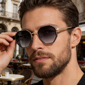 Fashion square black and gold sunglasses for men featuring a geometric frame on model