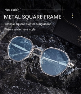 Silver metal square aviator sunglasses with light blue lenses on rugged stone background