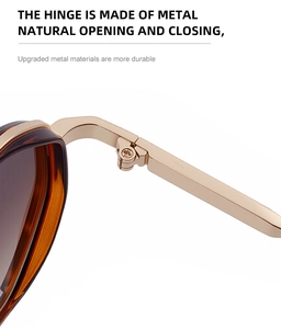 Macro detail of upgraded metal hinges on retro amber-patterned sunglasses for durability