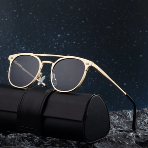 Golden aviator sunglasses with spring metal temples and premium black leather storage case