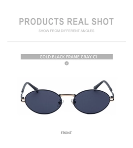 Front view of oval sunglasses with a gold and black metal frame and dark gray lenses