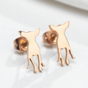 Macro shot of rose gold chihuahua silhouette earrings with modern cutout detail