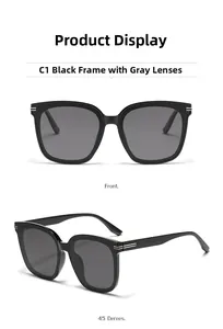 Détail de lunettes de soleil carrées oversize avec charnières en métal et verres foncés