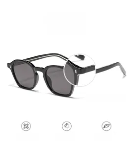 Detail of square black sunglasses with silver metal hinges and durable frame structure