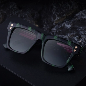 Retro square polarized sunglasses with dark marble green frame and hex rivet accents