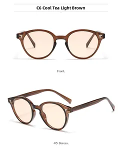 Close-up of translucent tea sunglasses with round frames and silver arrow hinges
