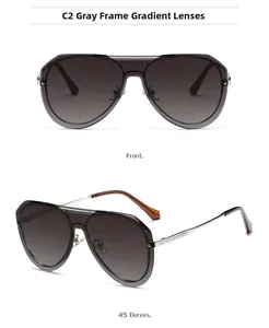 Close-up of pilot sunglasses with grey frame, gradient lenses and metal temple detail