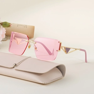 Frameless pink square sunglasses with gold triangle temples and leather case