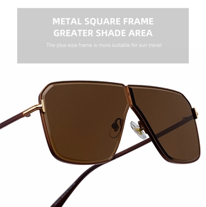 Close-up of metal square frame sunglasses with brown gradient lenses and gold temples