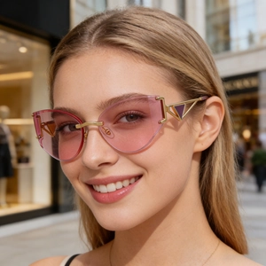 Lunettes de soleil œil de chat sans monture pour femmes avec verres dégradés roses