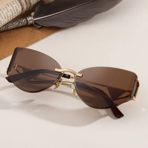 Lunettes de soleil œil de chat sans monture avec branches dorées et verres marron
