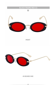 Detail view of oval black sunglasses with red lenses and slim gold metal temples