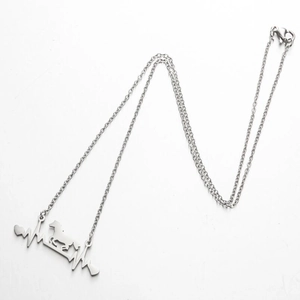 Polished stainless steel horse pendant necklace with heart pulse design on white background