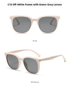 Dettaglio degli occhiali da sole quadrati beige con lenti grigio verdi e borchie