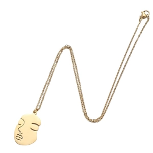 Abstract face pendant necklace in 18K gold plated stainless steel on white background
