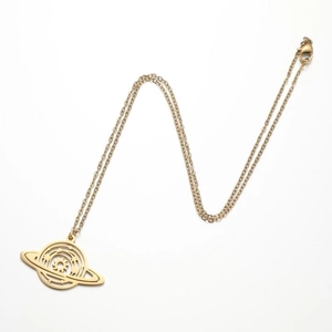 Detail of gold planet pendant necklace featuring hollow Saturn ring and sun orbital elements