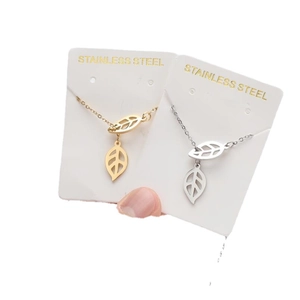 Minimalist stainless steel leaf pendant necklaces in gold and silver finishes
