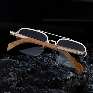 Close-up of retro rimless sunglasses featuring wood grain temples and double bridge metal frame