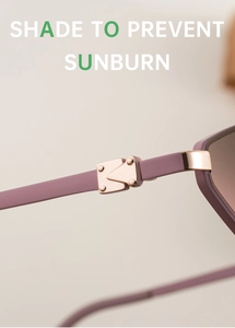 Detail of metal hinge with triangle rivet on trendy champagne purple sunglasses