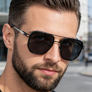 Detail of men's square sunglasses with double bridge and silver metal temple accents