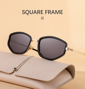 Chic square sunglasses with black geometric frames and gold temples on a beige pouch
