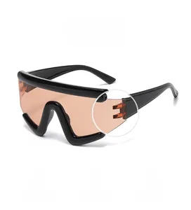 Detail of integrated hinges and locking structure on orange sports cycling sunglasses