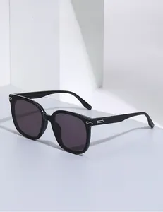 Detail of black square polarized sunglasses with silver metal temple accents