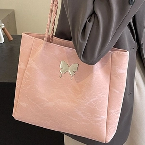 Pink PU leather tote bag with silver butterfly accent and woven strap for women